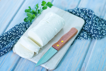 mozzarella on board and on a tableの写真素材