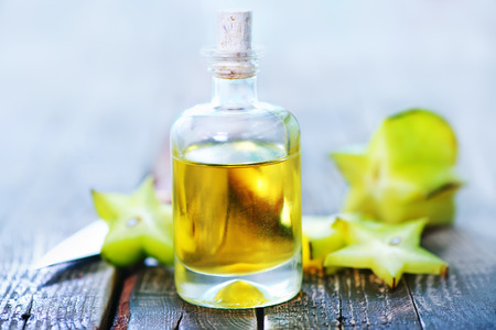 aroma oil in bottle and on a tableの写真素材