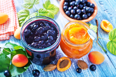 sweet jam in glass bank and on a tableの写真素材