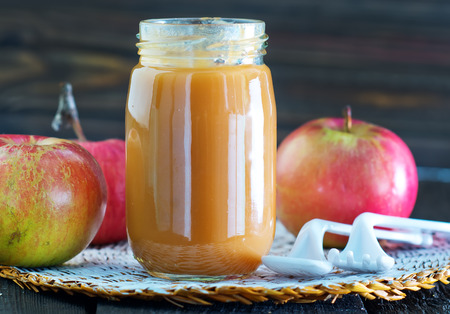 baby food in bank and on a tableの写真素材