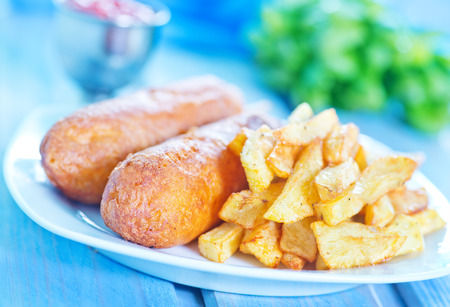 corndogs on the plate and on a tableの写真素材