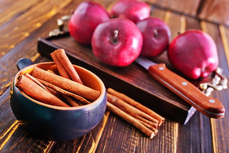 apples and cinnamon on the wooden tableの写真素材
