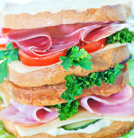 sandwiches with ham and cheese on the plateの写真素材