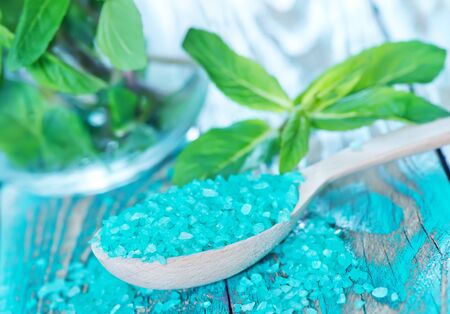 sea salt in spoon and on a tableの写真素材