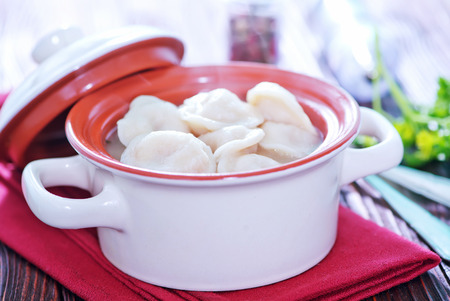 boiled pelmeni with butter in the bowlの写真素材