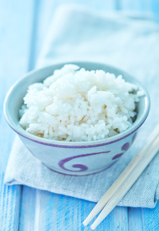 boiled rice in bowl and on a tableの写真素材