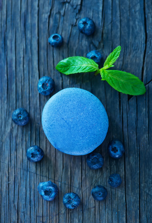 blueberry macaroon and berries on a tableの写真素材