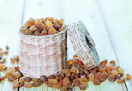 raisin in basket and on a tableの写真素材