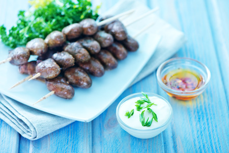 fried chicken heart with sauces in the bowlの写真素材
