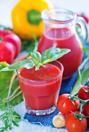 vegetable juice in glass and on a tableの写真素材