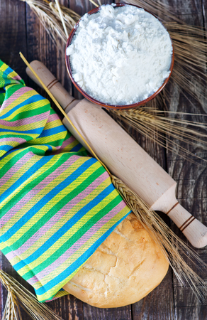 bread in napkin and on a tableの写真素材