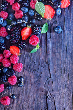 berries on the wooden table, mixed berries