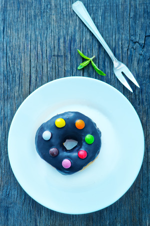 sweet baking, sweet donuts on the wooden tableの写真素材