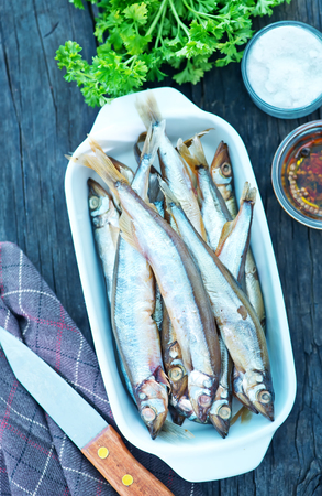 smoked fish with spice on a tableの写真素材