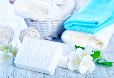 white aroma soap and flowers on a tableの写真素材
