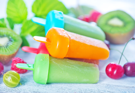 fruit ice cream on metal tray and on a tableの写真素材