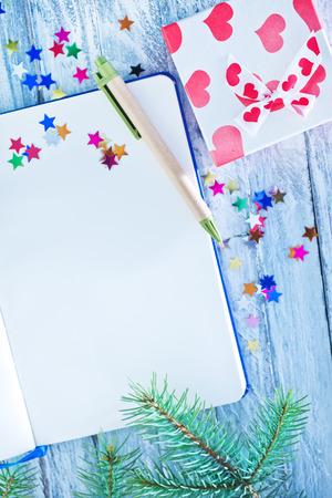 notebook and christmas decoration, notebook on a tableの写真素材
