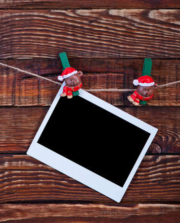 Christmas background.photo on wood background decorated with christmas clothespinの写真素材