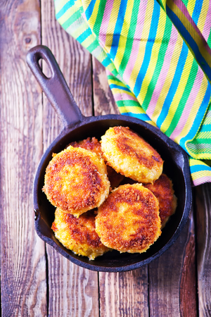 cutlets on pan and on a tableの写真素材