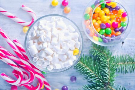 christmas sweety and decoration on a tableの写真素材