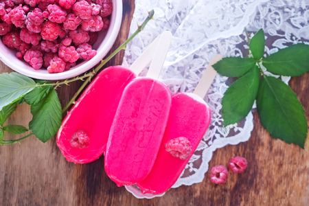 fruit ice cream and raspberry on a tableの写真素材
