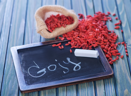 dry goji berries on the wooden tableの写真素材