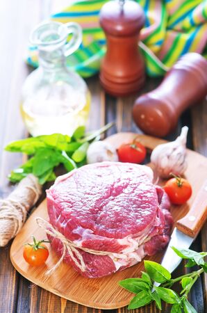 raw meat with spice and herb on a tableの写真素材