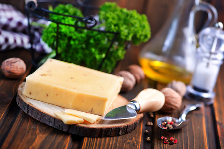 cheese on board and on a tableの写真素材