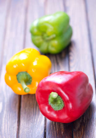 color sweet pepper on the wooden tableの写真素材