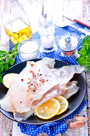 raw fish with aroma spice and fresh lemonの写真素材