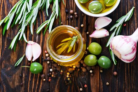 green olives and olive oil in bottleの写真素材