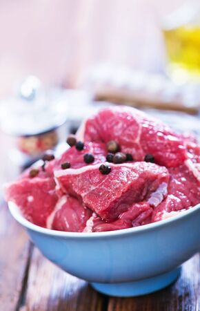 raw meat with aroma sxpice on a kitchen tableの写真素材