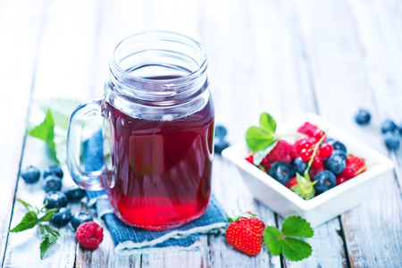 berry compot in glass and on a tableの写真素材
