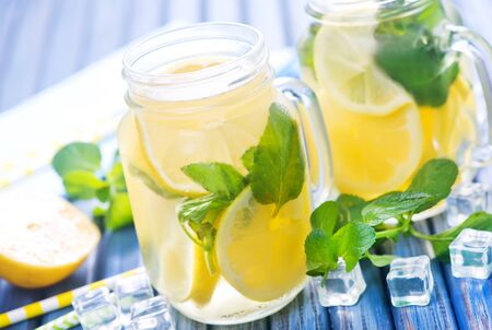 lemonate in glass and on a tableの写真素材