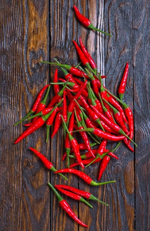 red hot chilli peppers on a tableの写真素材