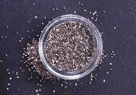 chia seeds on black table, raw chia seedの写真素材