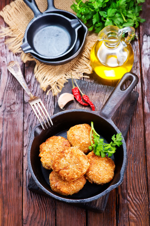 chicken cutlets with spice and fresh greensの写真素材