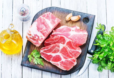 raw meat with aroma spice on a tableの写真素材
