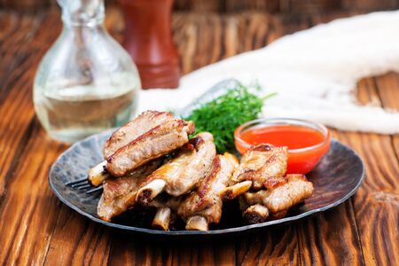 fried meat with sauce on a tableの写真素材