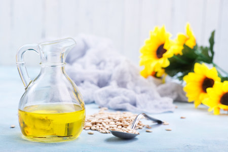 sunflower seed and oil on a tableの写真素材