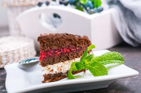chocolate cake on plate and on a tableの写真素材