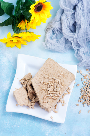 halva on plate and on a tableの写真素材