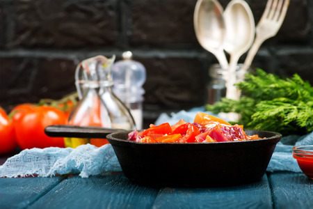fried vegetables with tomato sauce in the panの写真素材