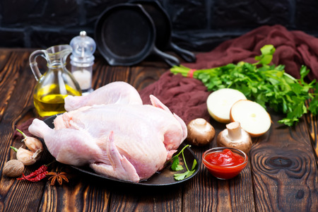raw chicken andaroma spice on a tableの写真素材