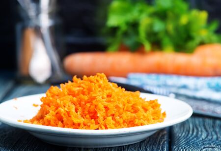 carrot on plate and on a tableの写真素材