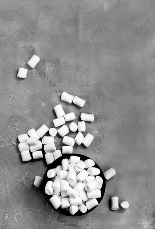 marshmallow in bowl and on a tableの写真素材