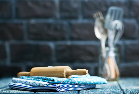kitchenware on the wooden table, napkin and kitchenwareの写真素材