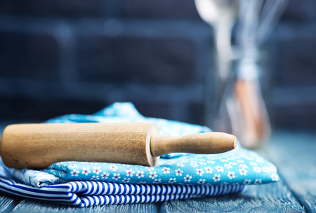 kitchenware on the wooden table, napkin and kitchenwareの写真素材