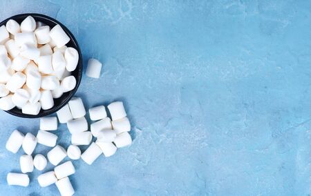 marshmallow in bowl and on a tableの写真素材