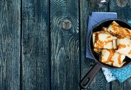pancakes on plate and on a tableの写真素材